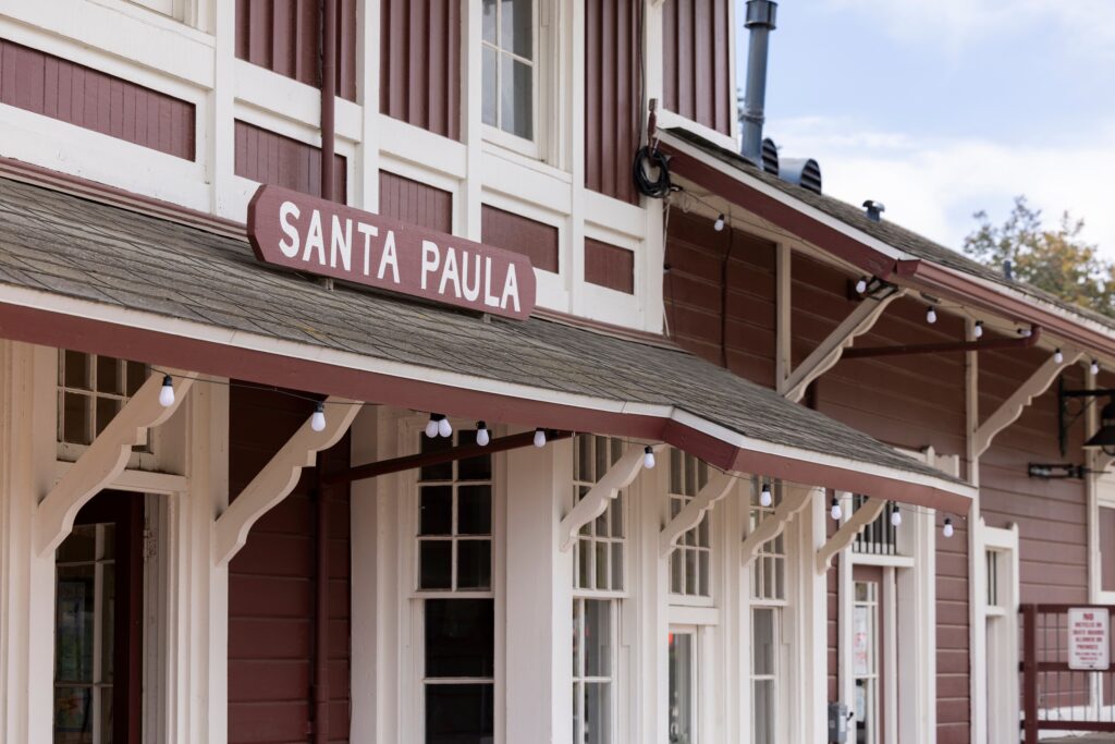 Cloudy afternoon sun shines on the historic downtown Santa Paula Train Depot