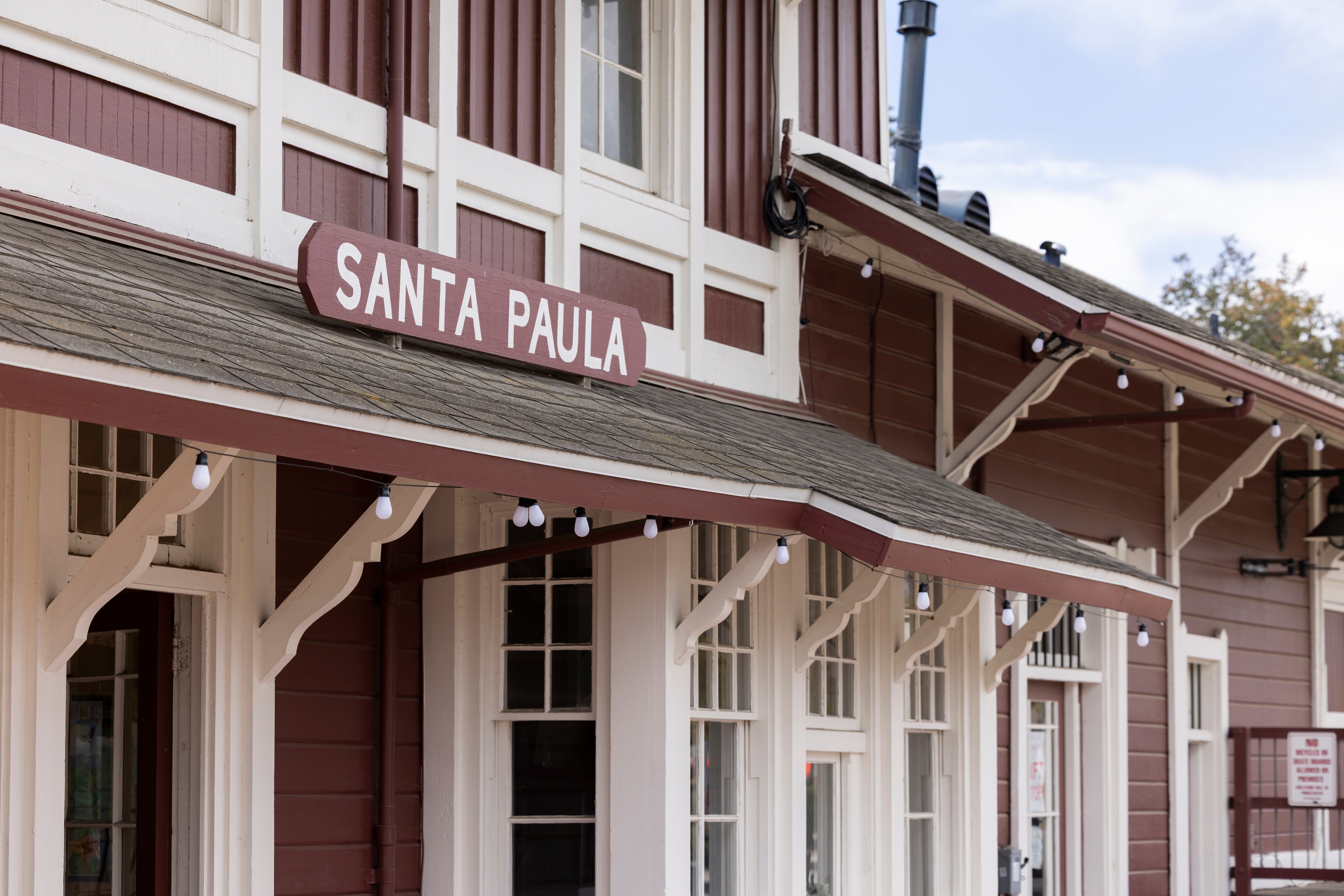 Cloudy afternoon sun shines on the historic downtown Santa Paula Train Depot