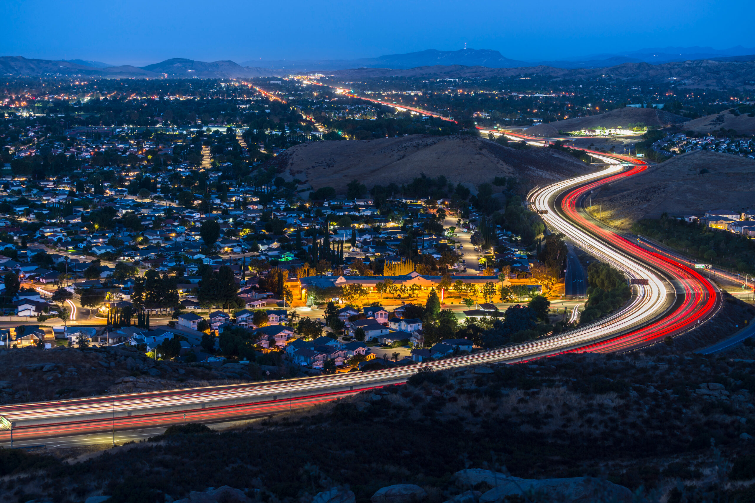 Twilight view of commuter freeway traffic in suburban Simi Valley